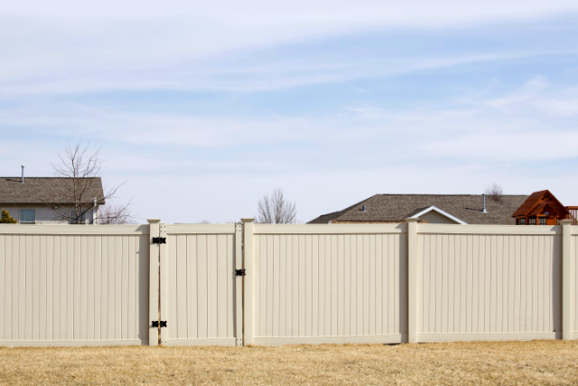 New Tan Vinyl Fence installed